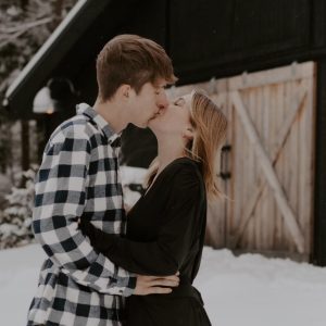 black barn alayna winter couple kissing barn